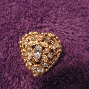 Gold tone brooch with clear rhinestones